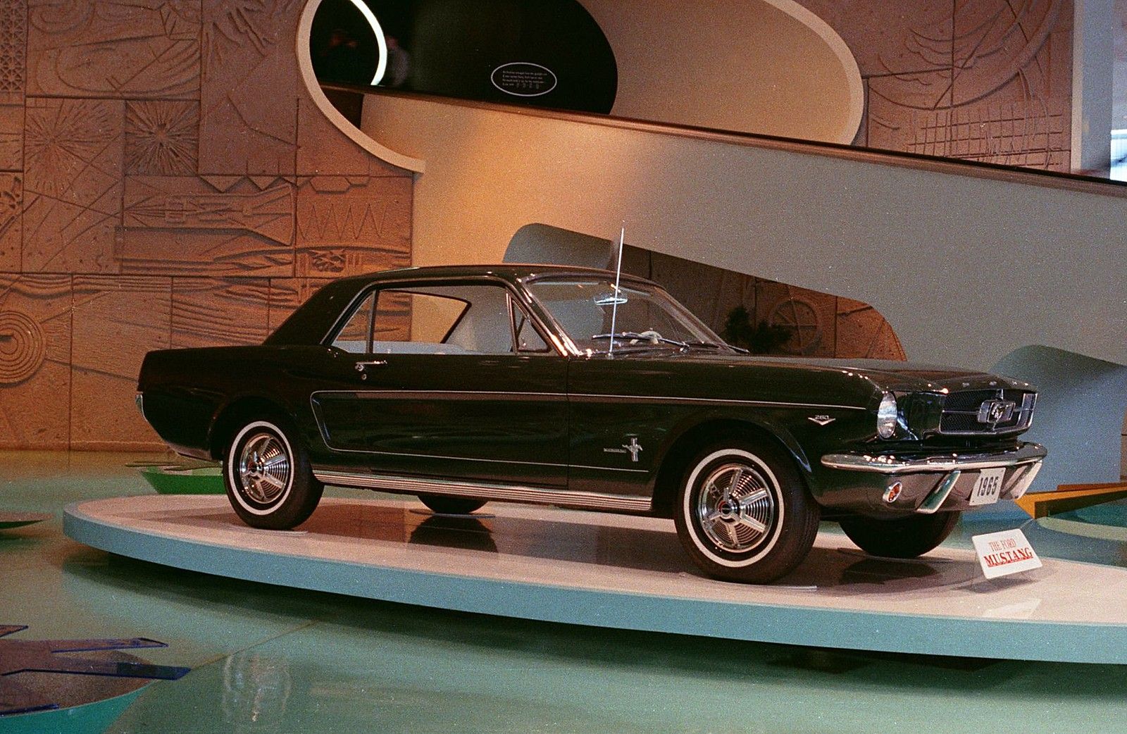 A black ’65 Mustang at the 1964-65 World’s Fair in New York. [Image via Flickr]